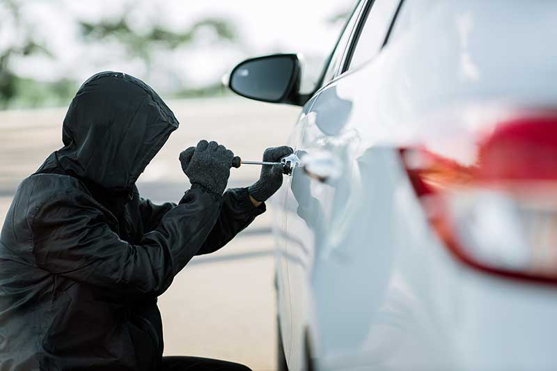 Shot of someone trying to break a car lock